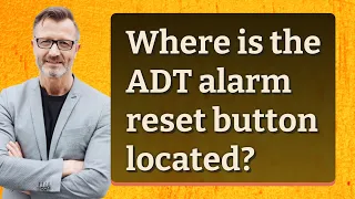 Where is the ADT alarm reset button located