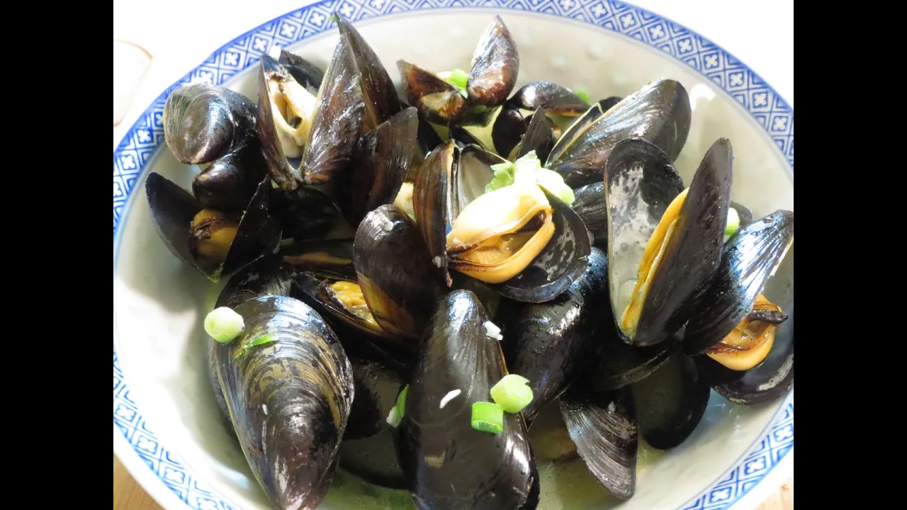 Mussels in white wine sauce with garlic, parsley, and butter is one of our favorite summer seafood r. 