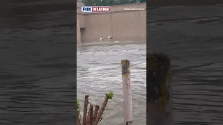 Shows Items from an Indiana Store Floating Away After Historic Flooding