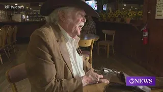 Western movie star Don Collier signing autographs in Mathis Texas