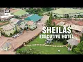 Lagu Binnen Sheilas Executive Hotel Sunyani – Rondleiding door zwembadbar, tuin, fitnessruimte, kamers...