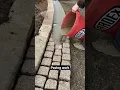 Download Lagu Pavement construction - worker laying granite stone pavers \u0026 pouring grout