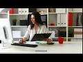 Brunette Businesswoman Working with Documents in Light Office Stock Footage - hive