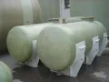 Fiberglass vessel in workshop and storage yard