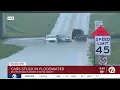 Cars stuck in water with multiple roads flooded in Wayne County