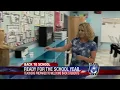 Katia Uriarte talks with a local teacher about returning to school