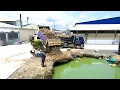 Download Lagu Incomplete Project by Bulldozer and Trucks Start to Pushing Rock to delete water in the sewer