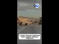 Loose trailer carrying boat darts across freeway