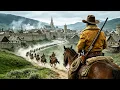 Bandits raid the town and seize a beauty unaware the man beside her is a top cowboy Western