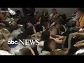 Migrant facility protests Navy SEAL acquitted uptick in shark attacks ABC News