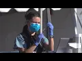 Drive-through vaccinations begin at Petco Park for healthcare workers in San Diego
