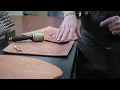 Inmate craftsmen at Fremont Correctional Facility s leather shop create a piece of Colorado history