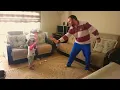 Baby plays sword fight with daddy