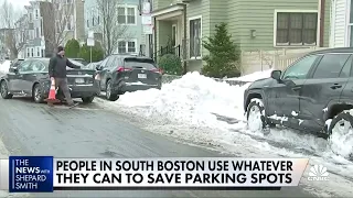 People in South Boston use random items to claim public parking spots after winter storms
