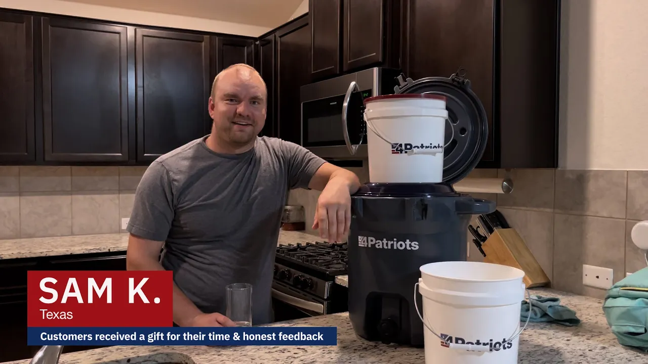 Sam K. from Texas demonstrates the 4Patriots Outdoor Filtration System in a home kitchen, highlighting its powerful water-purifying capabilities for emergency preparedness, camping, and off-grid living. Perfect for those searching for reliable gravity-fed water filtration solutions.