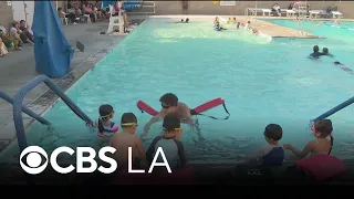 Pasadena parents take their kids to the pool as Southern California heat wave continues