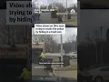 shows an Ohio man trying to evade the police by hiding in a trash can