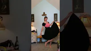 Dainty Rascal dancing in vintage black pink lace dress