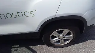 Flat Tire in Quest Diagnostics Vehicle