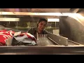 Behind the counter Food service workers doing their jobs