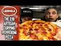 We ate the 18 artisan-style Cupping Pepperoni Pizza from Labriola Cafe with Truff Hot Sauce