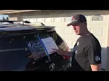 How to install a large vinyl sticker on the rear window of a vehicle