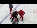 Red Wings Michael Rasmussen works with Luke Glendening on face-offs