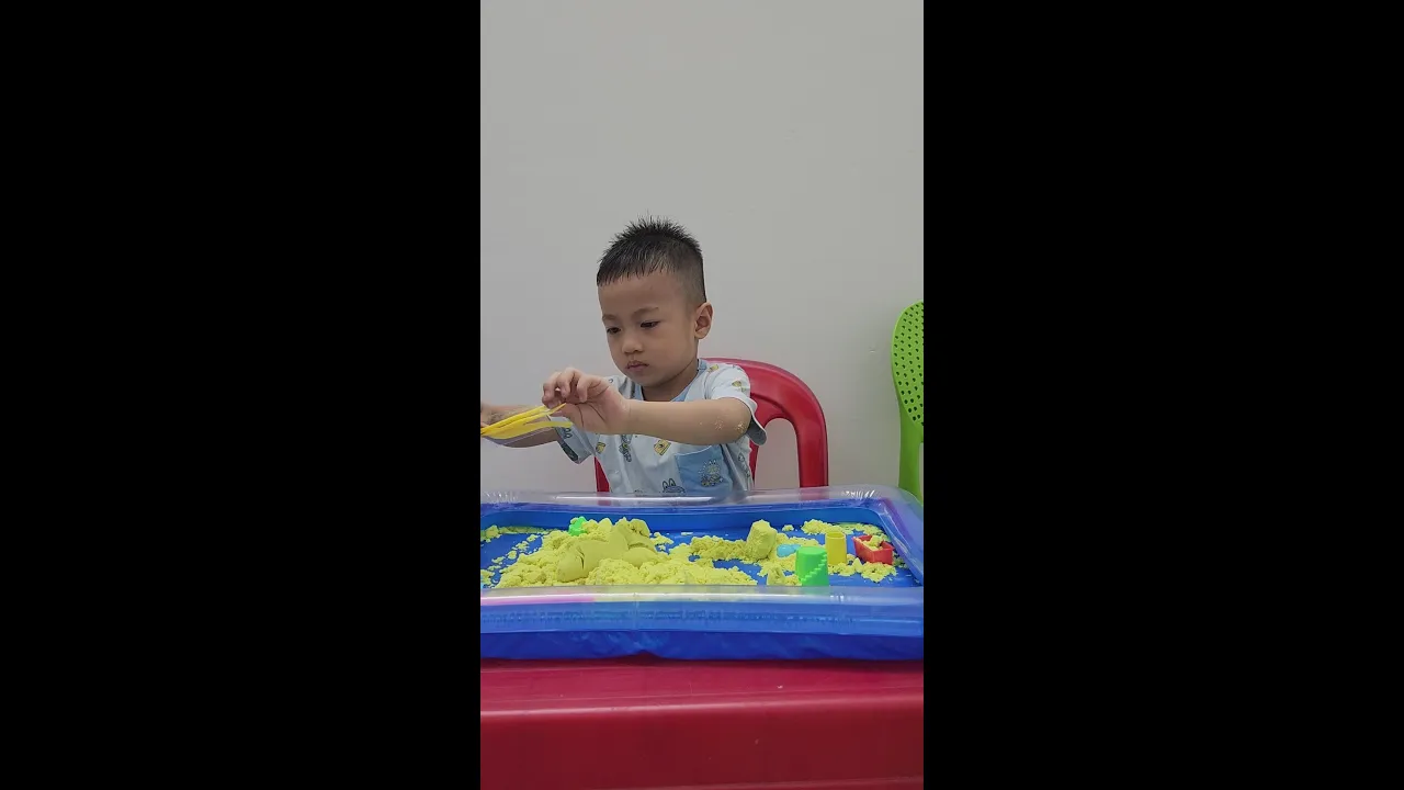 Baby Tom playing sand
