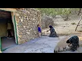 Download Lagu A mother in the mountains repairs her house for the winter season.