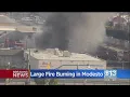 Large fire burns at Modesto junk yard