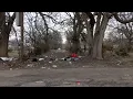Woman dies after contact with garbage truck equipment in west Louisville alley