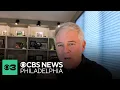 Lou Tilley congratulates Ukee Washington on 40 years at CBS Philadelphia