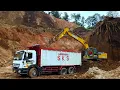 Download Lagu Process of the Excavator Loading Trucks for the Toll Road Construction on the Dirt Quarry
