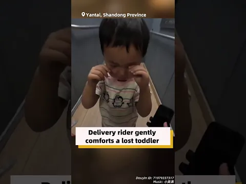 Delivery rider gently comforts a lost toddler