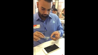 unintentional asmr employee applying screen protector