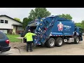 2 Republic Services Rear Loader Garbage Trucks Packing Massive Messy Bulk Trash Pile