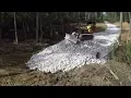 Installing A Culvert Pipe For The Driveway And Covering With Surge