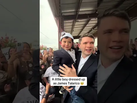 A little boy dressed up as James Talarico