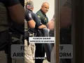 Now-suspended Osceola County FL Sheriff Marco Lopez arrested taken into handcuffs in uniform