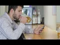 A Young Man Holding a Glass Of Beer Stock Footage - hive