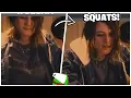 Demondice squats in her chair