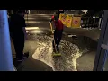 Heavy rain floods the entrance of the Microsoft Theatre in Downtown LA