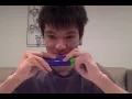 stupid tone deaf asian kid plays mii song on harmonica