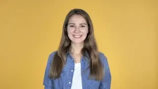 Yes Pretty Woman Shaking Head To Accept Isolated on Yellow Background Stock Footage - hive