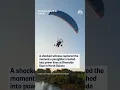 A shocked witness captured the moment a paraglider crashed into power lines in North Dakota
