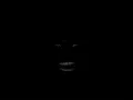 man laughing in the dark