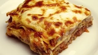 The ultimate comfort food lasagna, with layers of rich homemade meat sauce, creamy béchamel sauce , . 