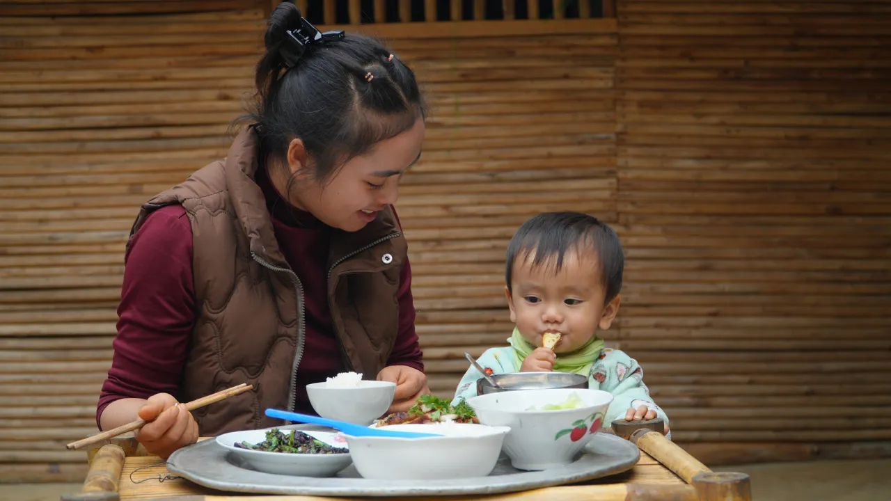 On a peaceful weekend, Ly Thi Di enjoys quality time with her son.