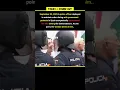 Wife Stands In Protest Opposite Her Police Officer Husband