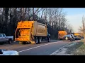 2 Town Of Huntington Garbage Trucks Passing By The Park